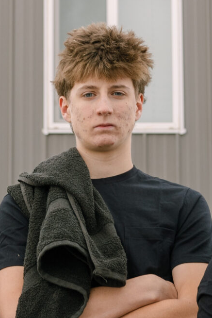 Person with towel, casual attire.