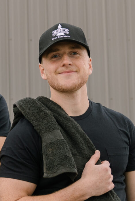 Person in black shirt and cap